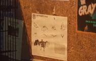 Spot this tiny poster just below the Gray Ghost poster (Image via WB Games)